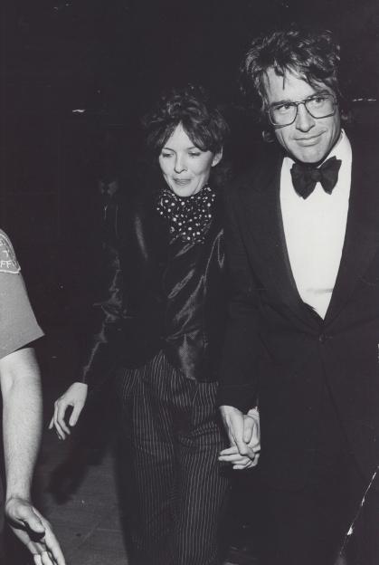 Warren Beatty and Diane Keaton holding hands.
