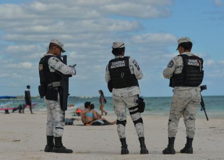 Mexican National Guard patrolling a beach.