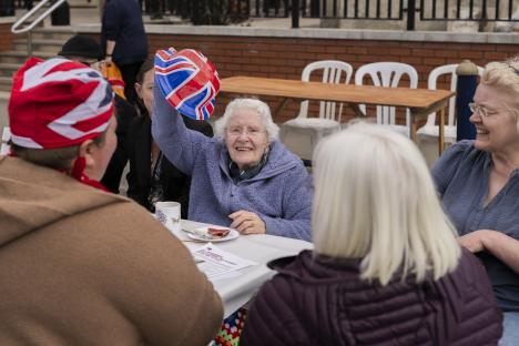 People celebrating VE Day at a street party in Lytham, England.