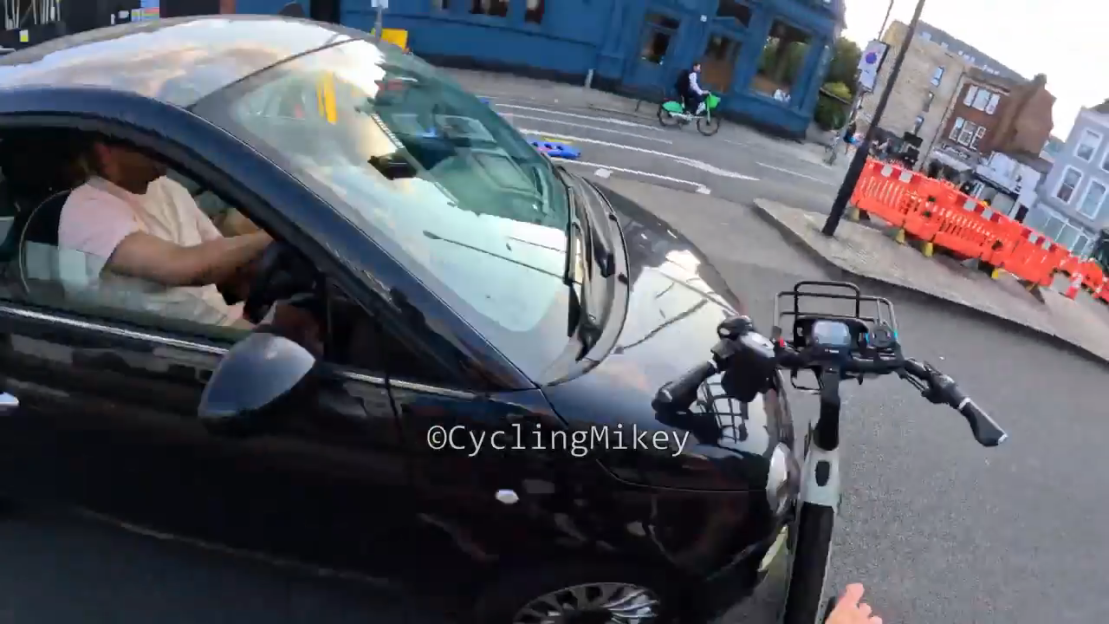 Moment vigilante cyclist pushes his bike into a car he was trying to stop at ‘no entry’ sign sparking furious row