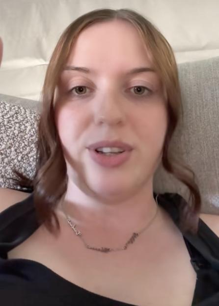A young woman speaking to the camera.