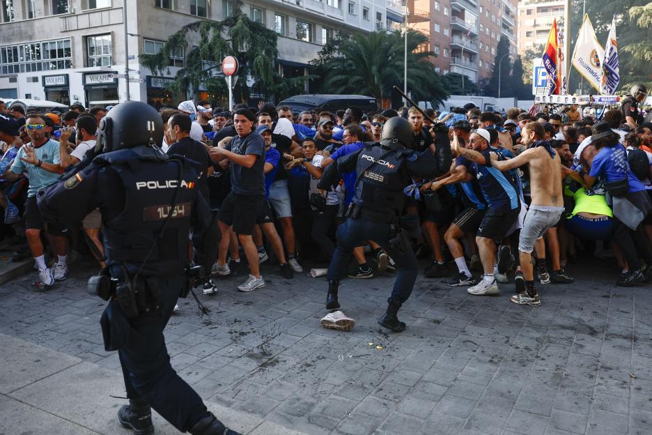 Shocking moment Marseille fans clash with riot police in ugly scenes before Real Madrid match