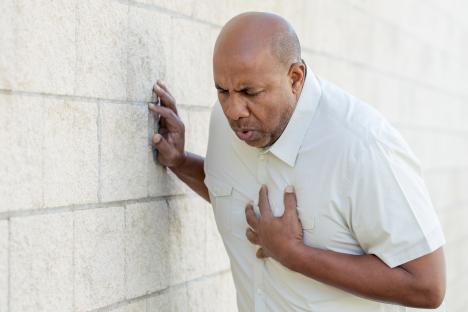 Man clutching his chest in pain.