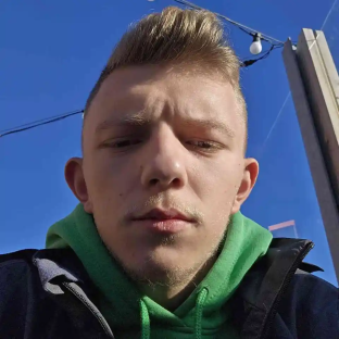 Close-up selfie of a young man.