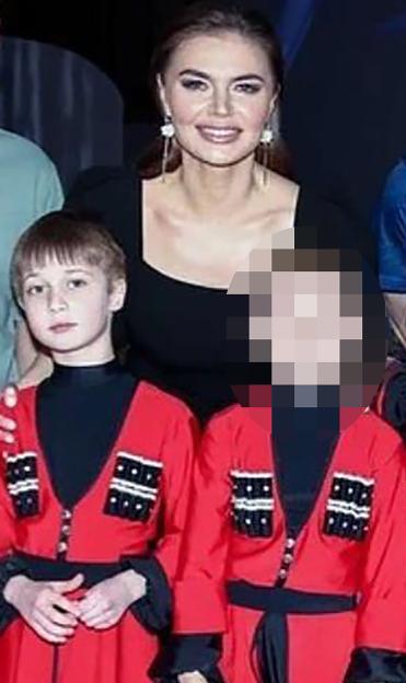 Alina Kabaeva and her reported sons, Ivan and another child.