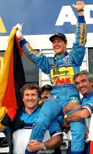 Michael Schumacher, the first German Formula 1 world champion, being celebrated by his team.