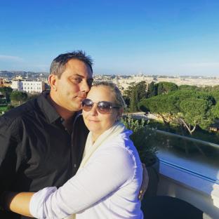 Virginia Giuffre and her husband Robert embracing with Rome in the background.