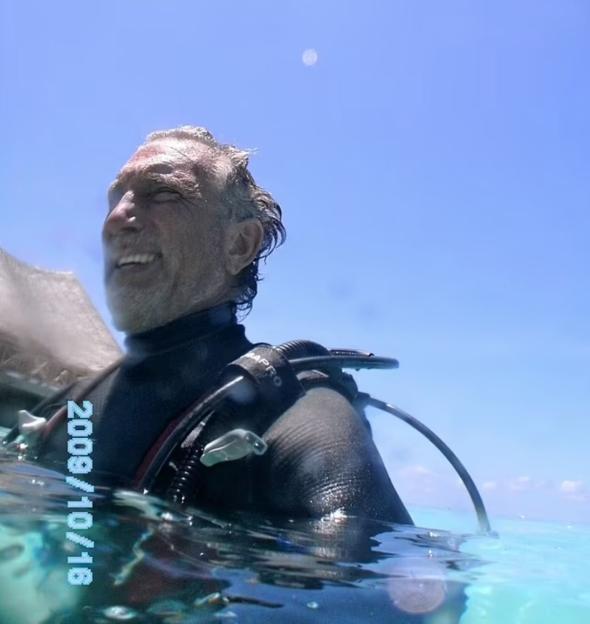 Man in scuba gear in the water.