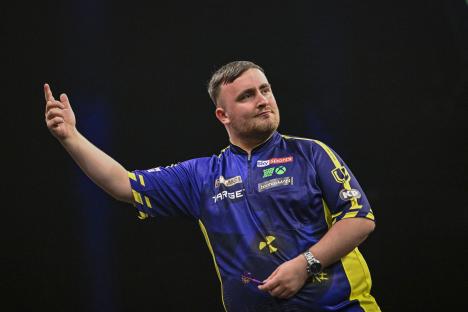 Luke Littler celebrating a darts win.