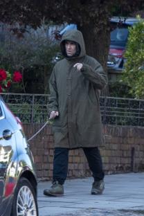Liam Gallagher walking a dog.