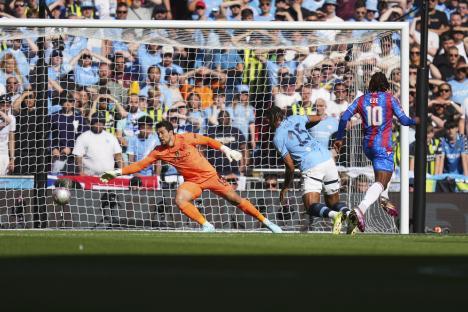 Eberechi Eze scoring a goal during a soccer match.