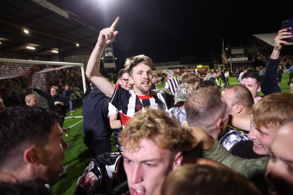 Fans celebrating a Grimsby Town victory.