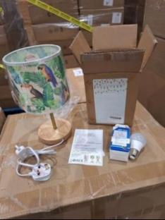 Recalled bedside lamp with tropical bird print shade and packaging.