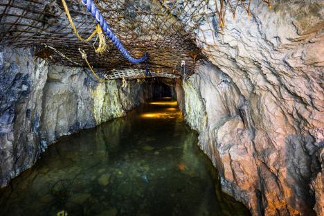 Interior view of a flooded mine tunnel in Osówka, Poland.