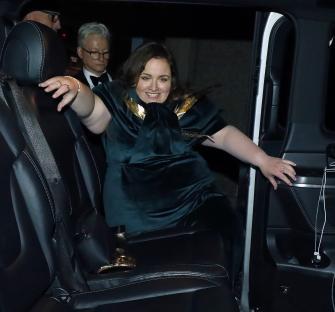 Jessica Gunning exiting a vehicle.