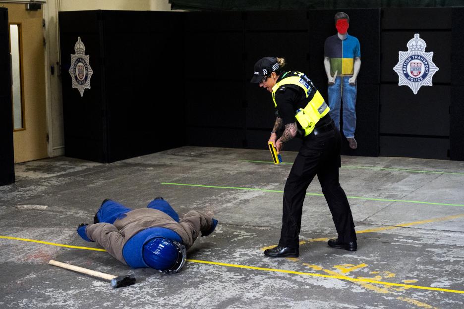 A firearms officer demonstrating the 'Taser 10' at the British Transport Police headquarters in central London.