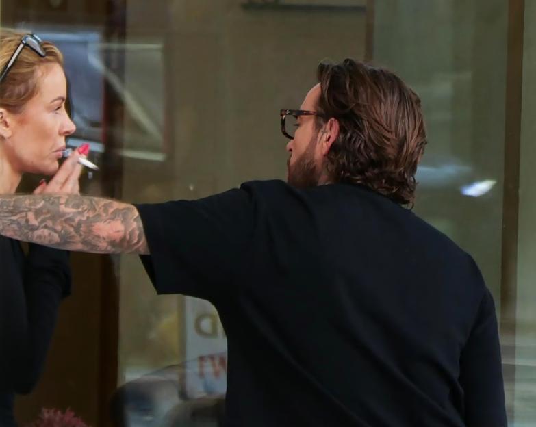 Pete Wicks and Olivia Attwood smoking outside a recording studio.