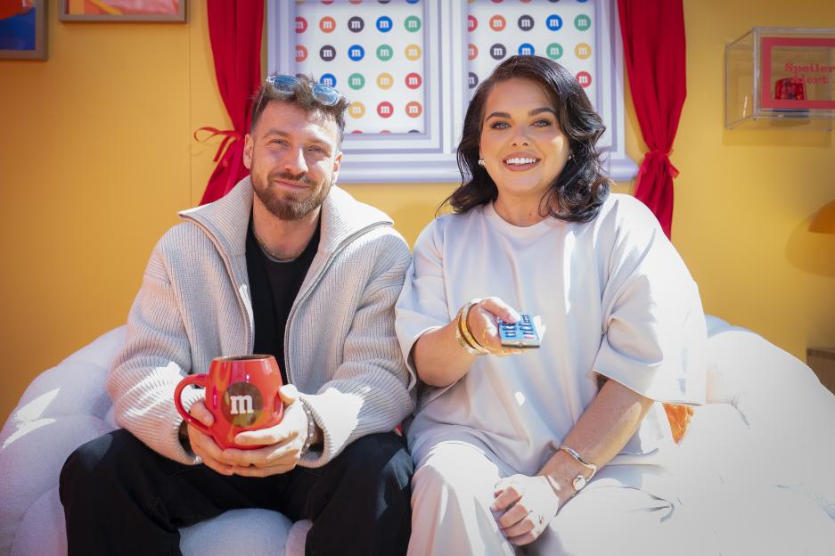 Sam Thompson and Scarlett Moffatt hosting a TV show.