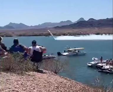 Watch as out-of-control speedboat hurtles through air at 200mph before smashing into lake in front of stunned crowd