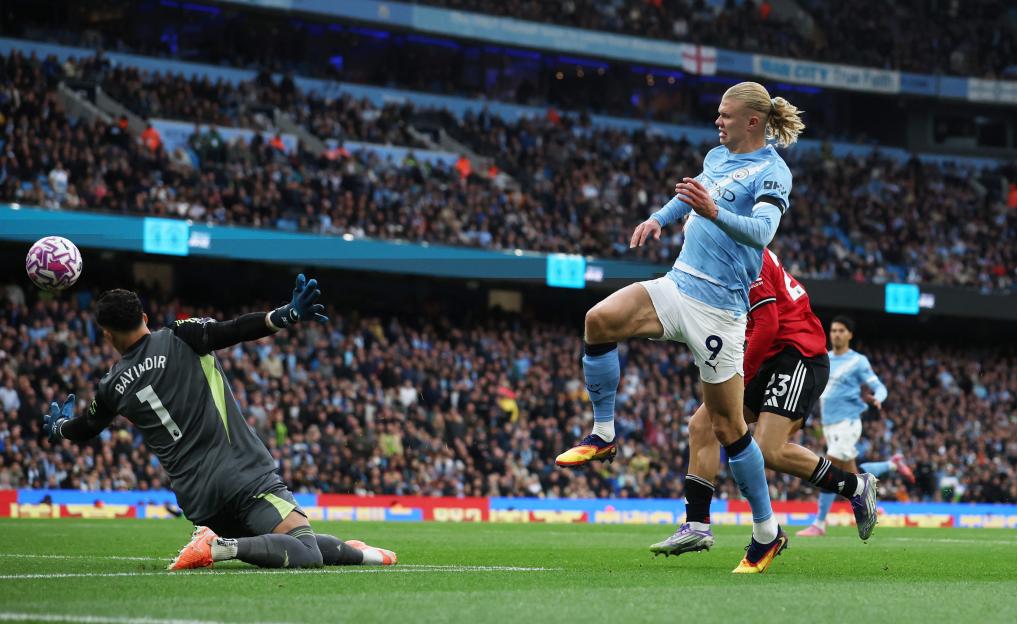Erling Haaland scoring a goal for Manchester City.