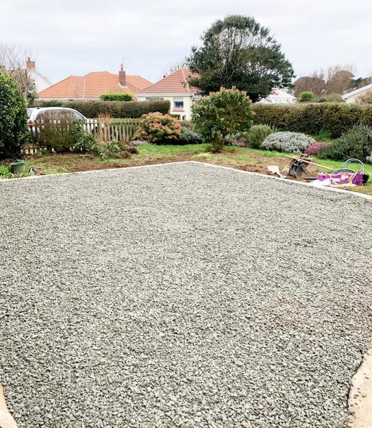 Gravel driveway under construction.