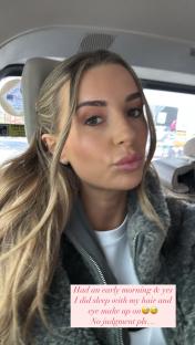 Woman in car, wearing makeup and stating she slept with her makeup and hair on.