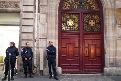 French police officers outside Kim Kardashian's Paris apartment after a robbery.