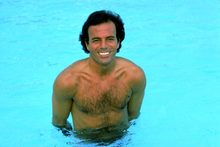 Spanish singer Julio Iglesias in a swimming pool.