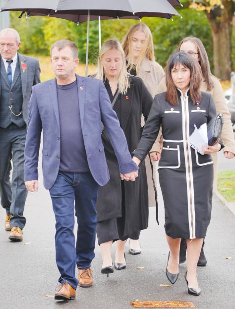 Anthony Beck and Leighann McCready, parents of Jaysley Beck, arrive at Bulford Court Martial Centre, holding hands and wearing poppies.