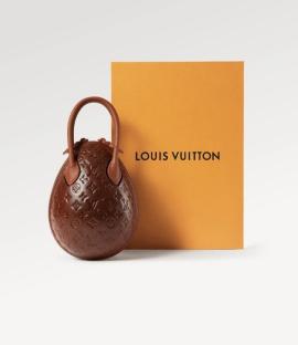 Louis Vuitton egg-shaped handbag next to its box.