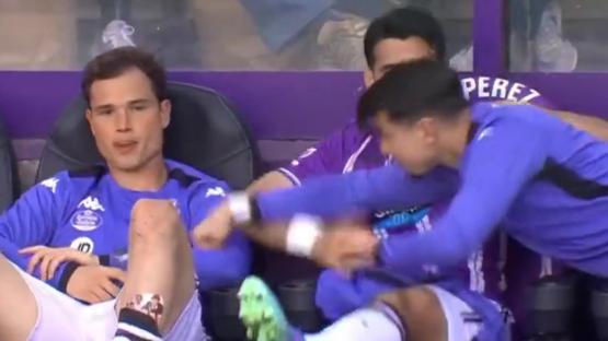 Shocking moment footballer PUNCHES team-mate in fit of rage before he is restrained by fellow player