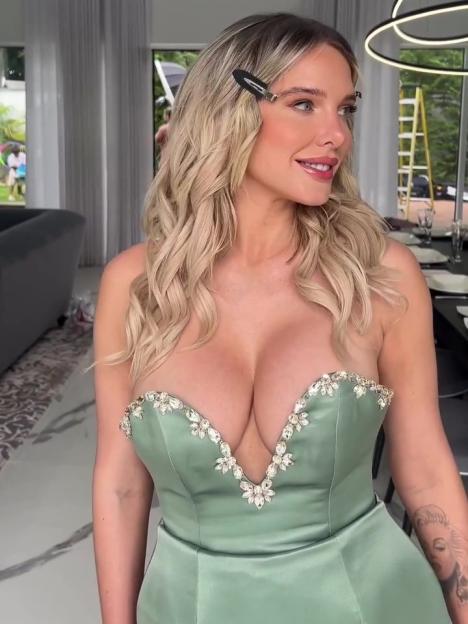 Helen Flanagan in a sage green, low-cut, embellished gown.