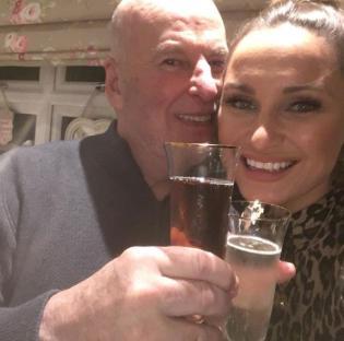 Dave Chatwood and Sam Faiers toasting with champagne flutes.