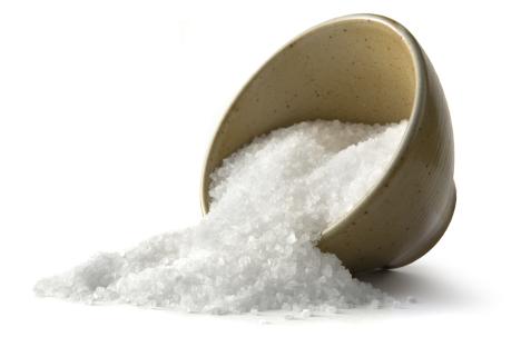 Salt spilling from a bowl.