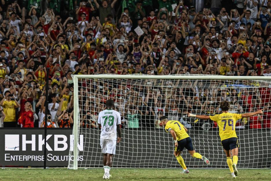 Cristiano Ronaldo celebrating a goal during a soccer match.