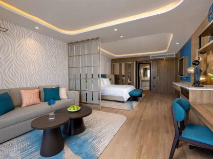 Hotel suite with living area and bedroom.