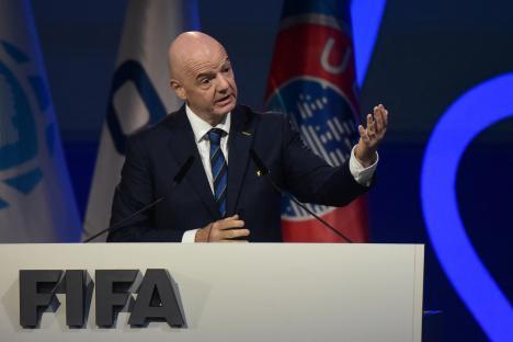 FIFA president Gianni Infantino speaking at a podium.