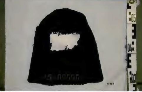 Black mask with a light-colored section missing.