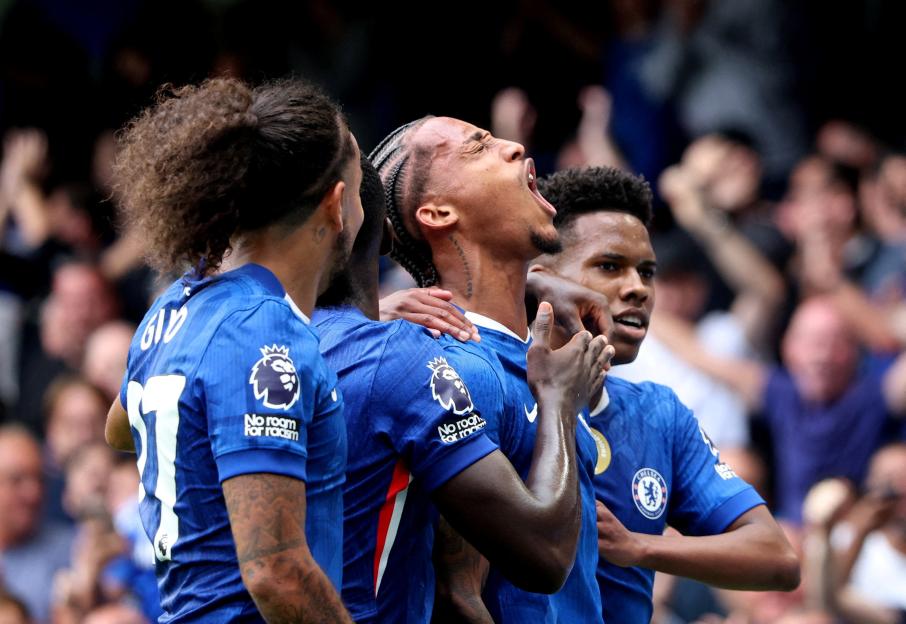 Chelsea's Joao Pedro celebrates scoring a goal with teammates.