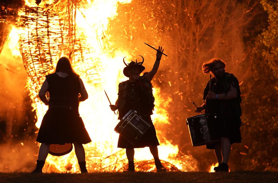 Pentacle Drummers perform at a bonfire.