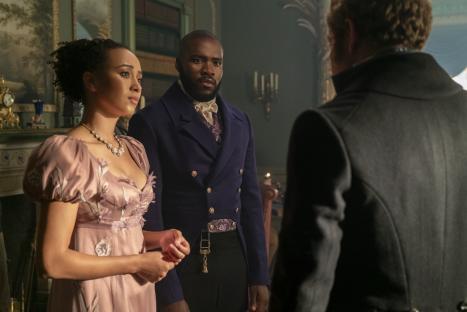 Scene from Bridgerton showing Alice and Will Mondrich speaking to another person.