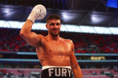 Tommy Fury celebrates a boxing victory.