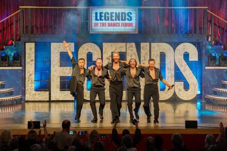 Four dancers on stage during a performance of Legends of the Dance Floor.