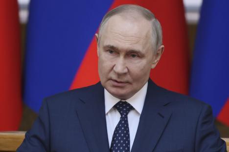 Vladimir Putin speaking at a meeting.