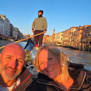 Couple in gondola in Venice, Italy.