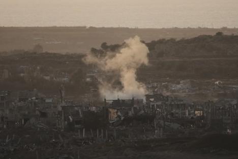 Smoke rises from bombed-out buildings in Gaza.