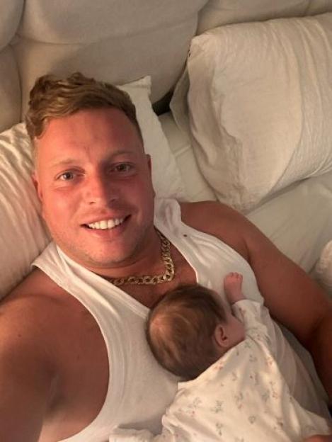 Man holding his baby.