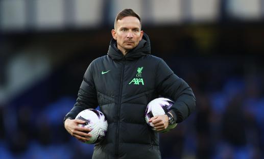 Pepijn Lijnders, Liverpool's assistant manager, holding soccer balls.