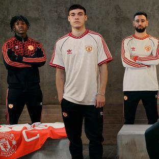 Three Manchester United players modeling the new Adidas kit.