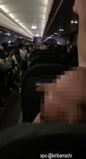 Video of noisy passengers on a crowded airplane.